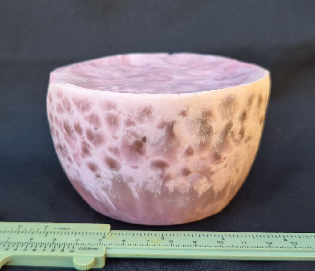 Pink chatoyant glass boule 1472g - flat lay with ruler showing honeycomb formations