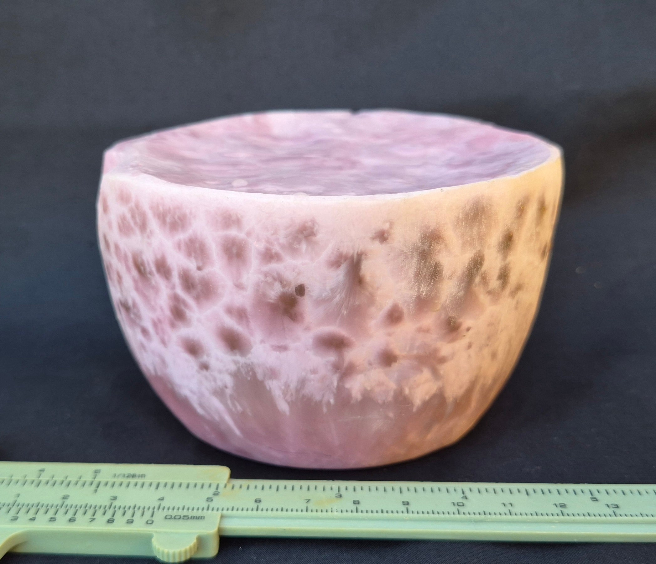Pink chatoyant glass boule 1472g - flat lay with ruler showing honeycomb formations