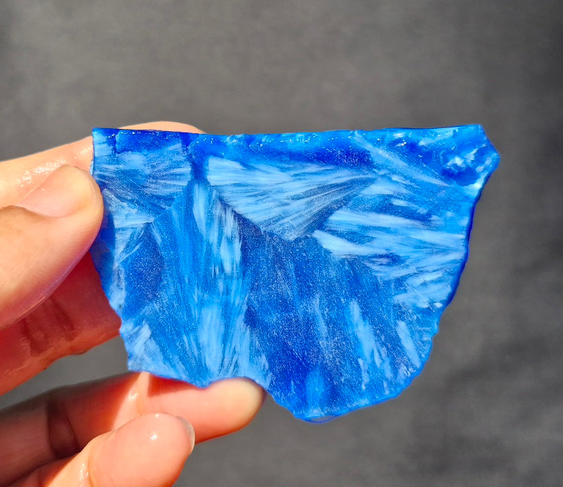Blue chatoyant glass slab 42g - hand held view