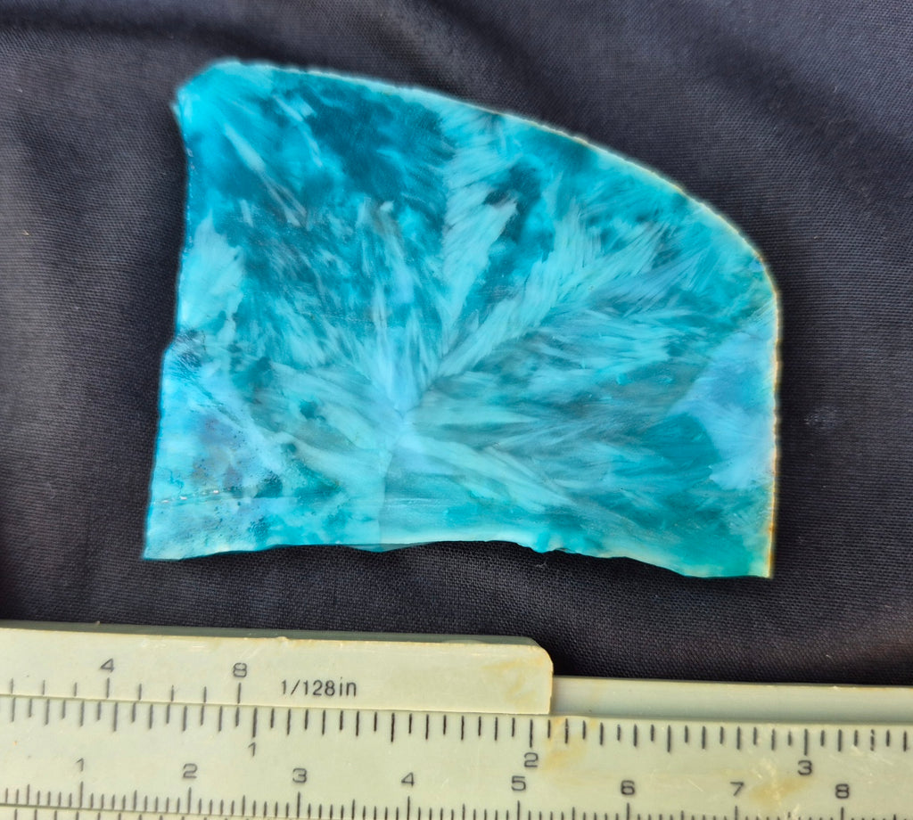 Teal blue chatoyant glass slab 49g - flat lay with ruler