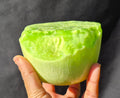 Lime green chatoyant glass boule 1440g - hand held view