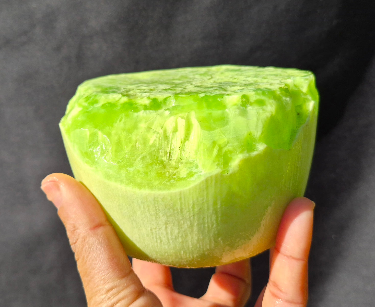 Lime green chatoyant glass boule 1440g - hand held view