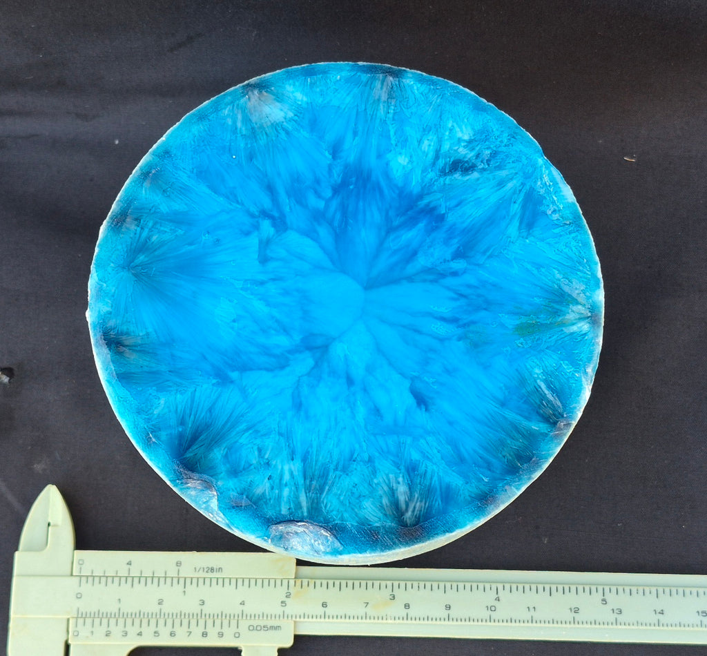 Cyan blue chatoyant glass boule 1455g - flat lay with ruler
