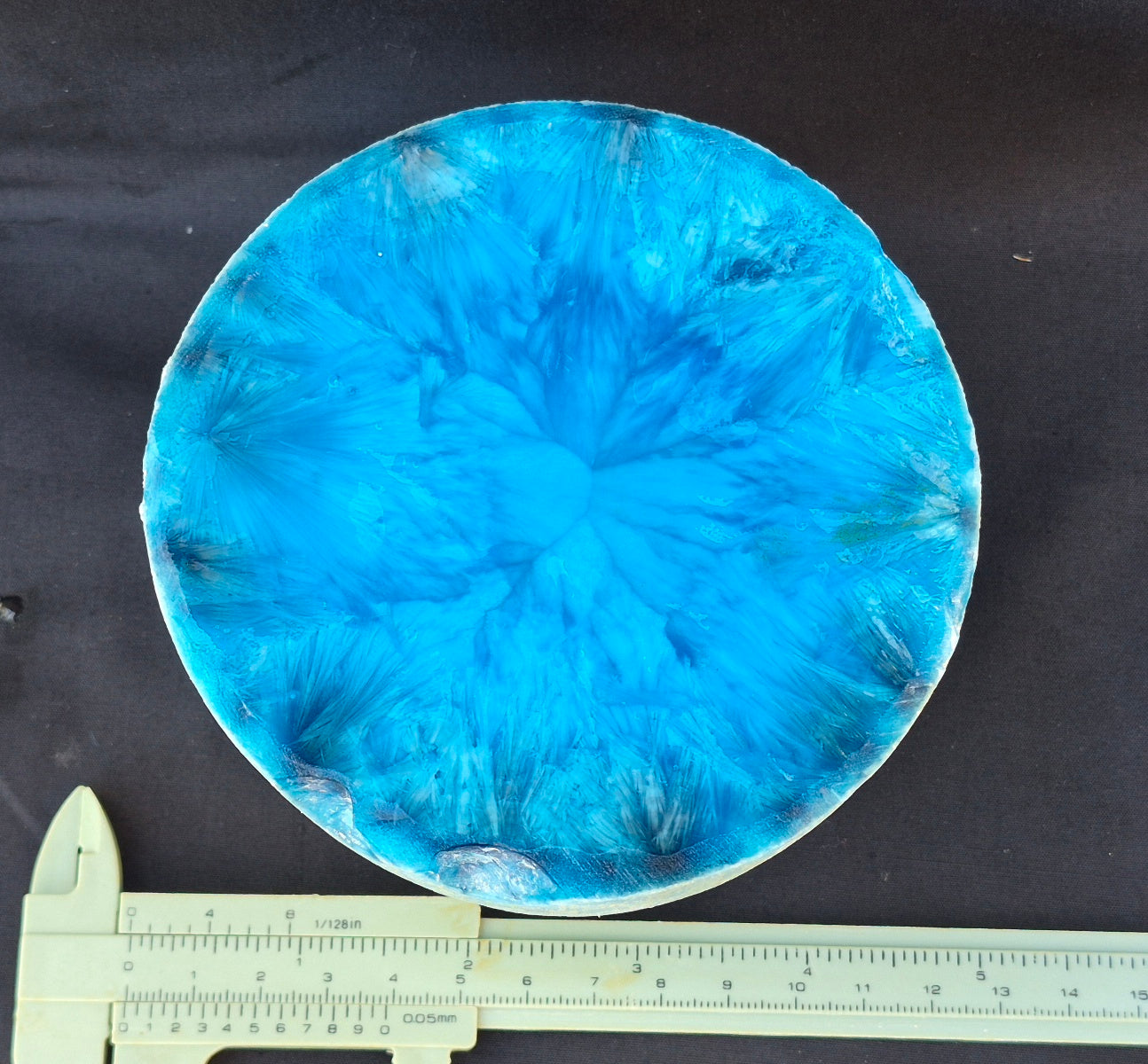 Cyan blue chatoyant glass boule 1455g - flat lay with ruler