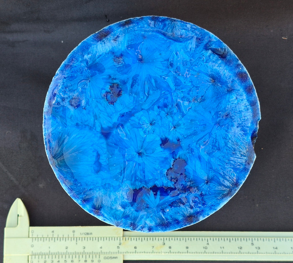 Blue chatoyant glass boule 1352g - flat lay with ruler