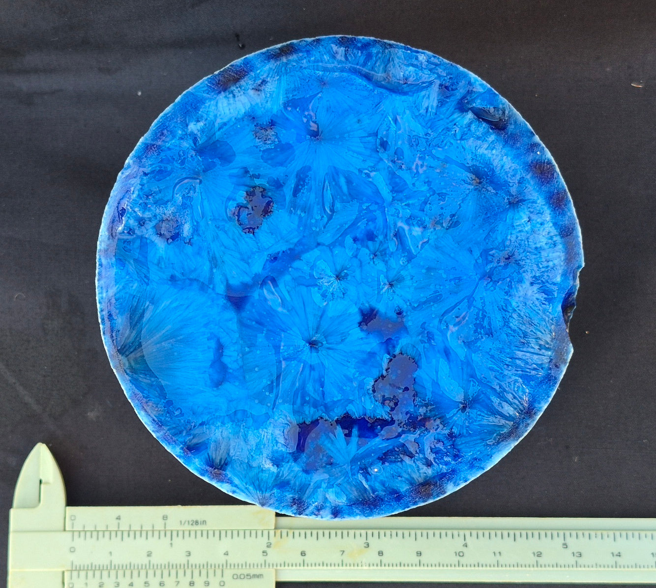 Blue chatoyant glass boule 1352g - flat lay with ruler
