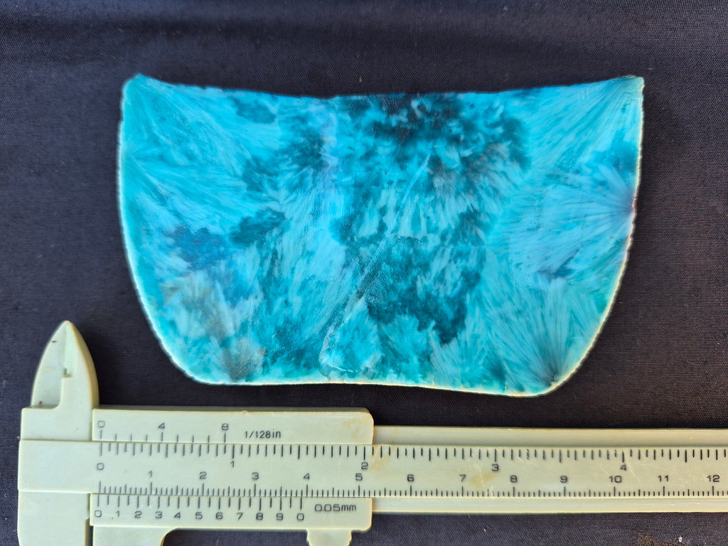 Teal blue chatoyant glass slab 121g - flat lay with ruler