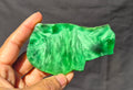 Green chatoyant glass slab 81g - hand held view