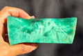 Green raw chunk 459g – SBSR 117, hand held showing chatoyancy