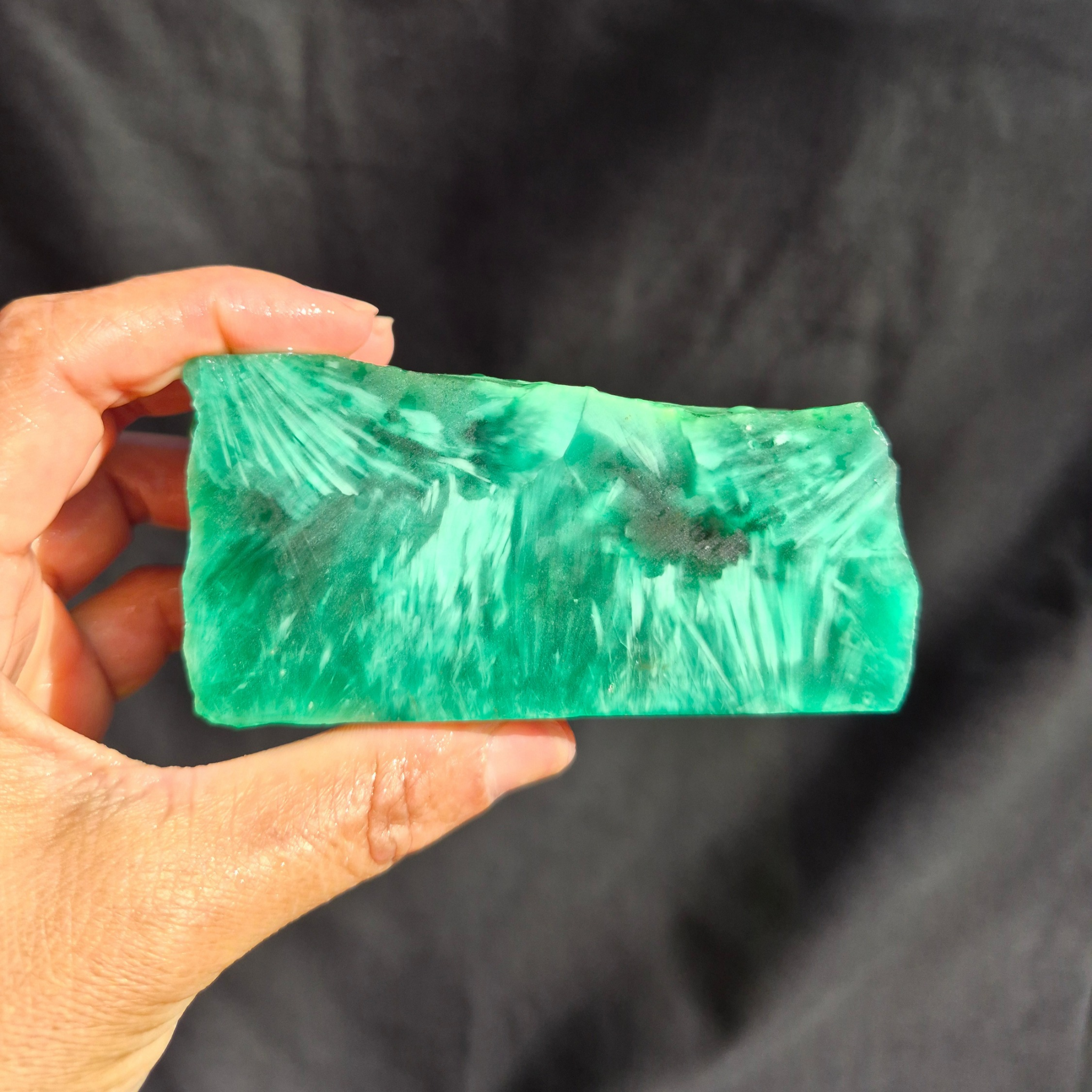 Green chatoyant glass raw chunk SBSR 132 - hand held front view
