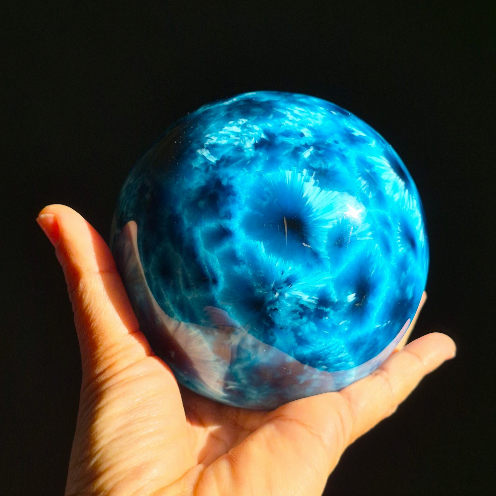 Starburst Glass Sphere Ocean Blue held in hand, view 1