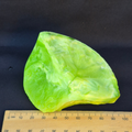 Lime green chatoyant glass raw chunk - angle view