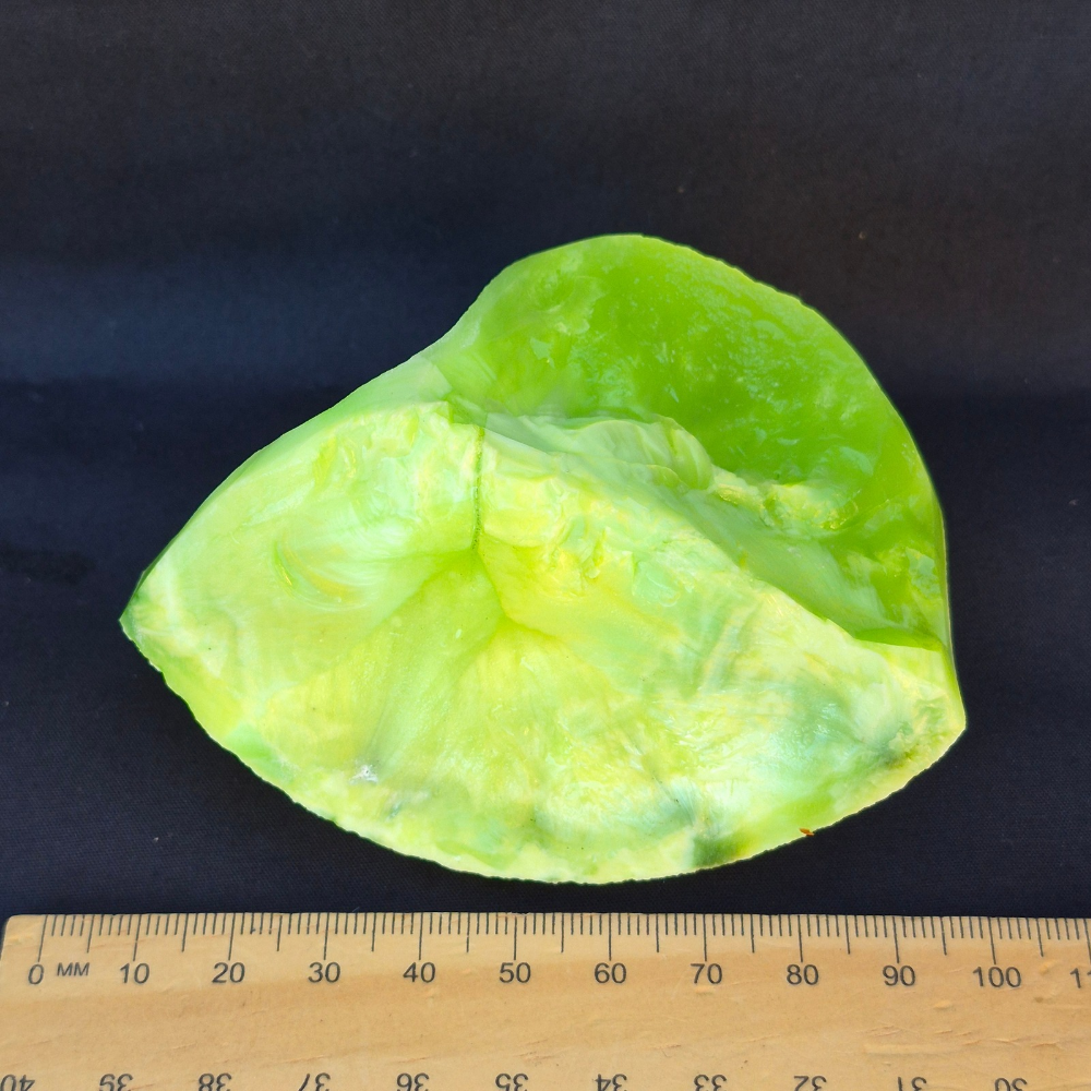 Lime green chatoyant glass raw chunk - top view