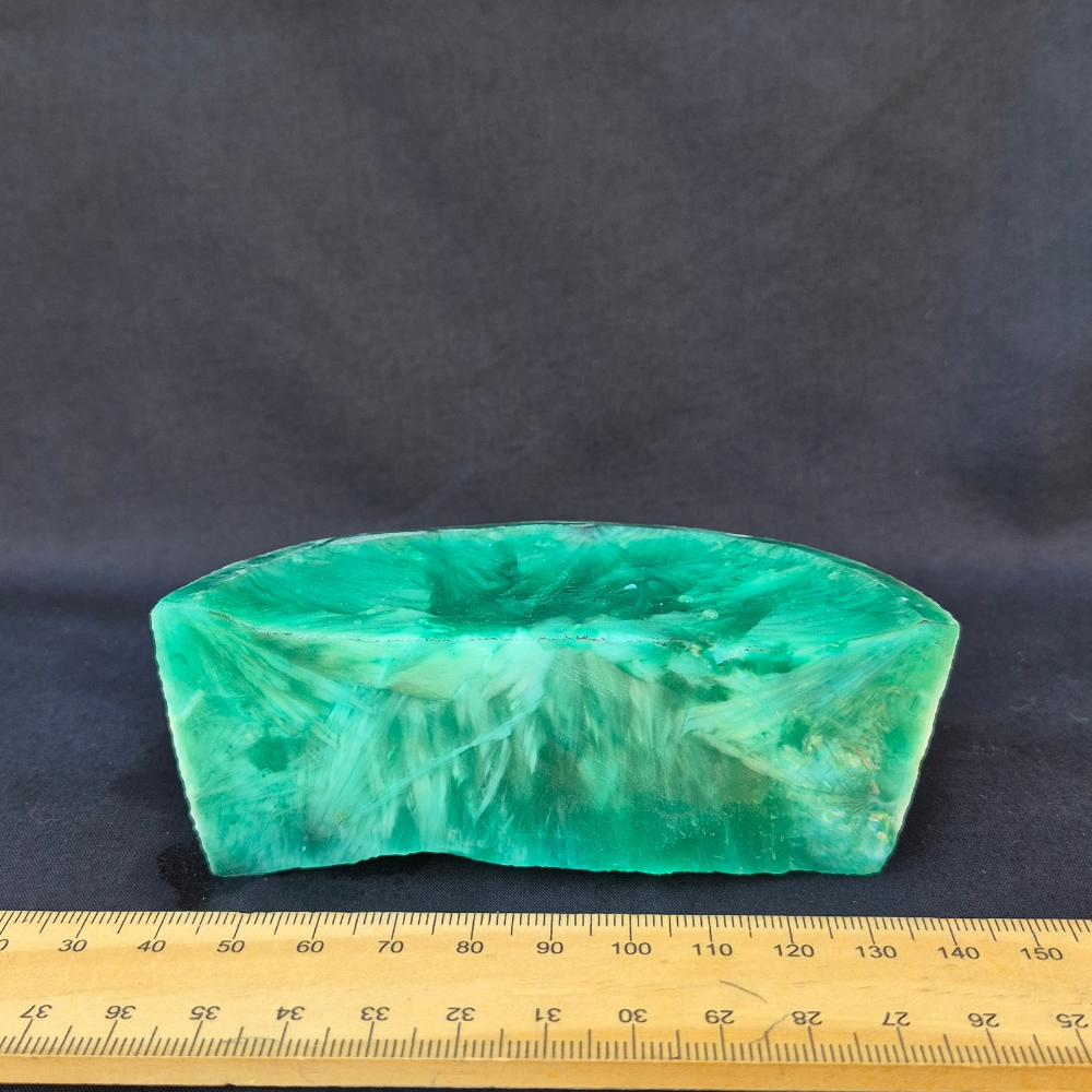 Green chatoyant glass raw chunk - side view