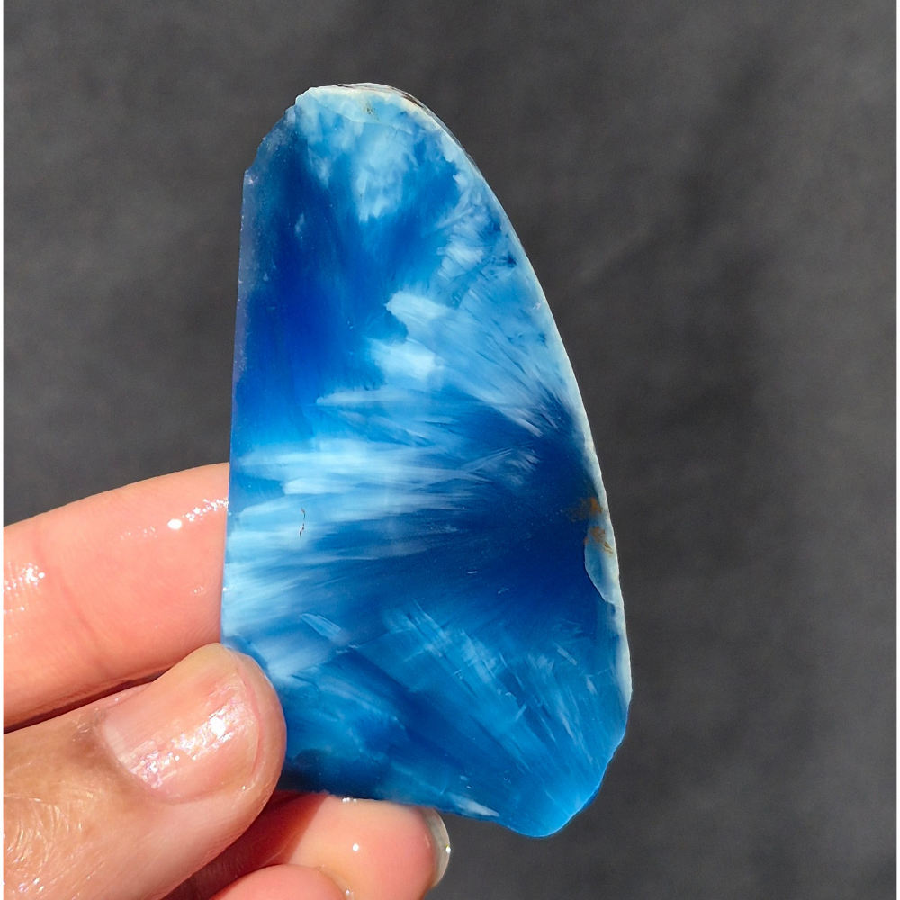 Blue chatoyant glass slab 22g - hand held view