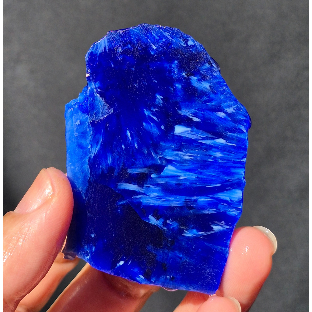 Cobalt blue chatoyant glass slab 37g - hand held view